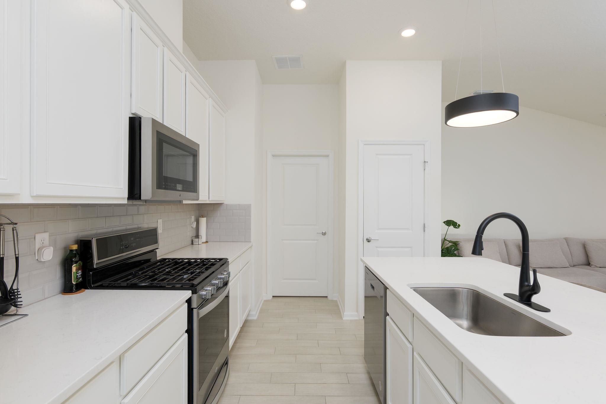 28 Peace River Road St. Johns, FL 32259 - Photo 12 of 42 a kitchen with a sink cabinets and appliances