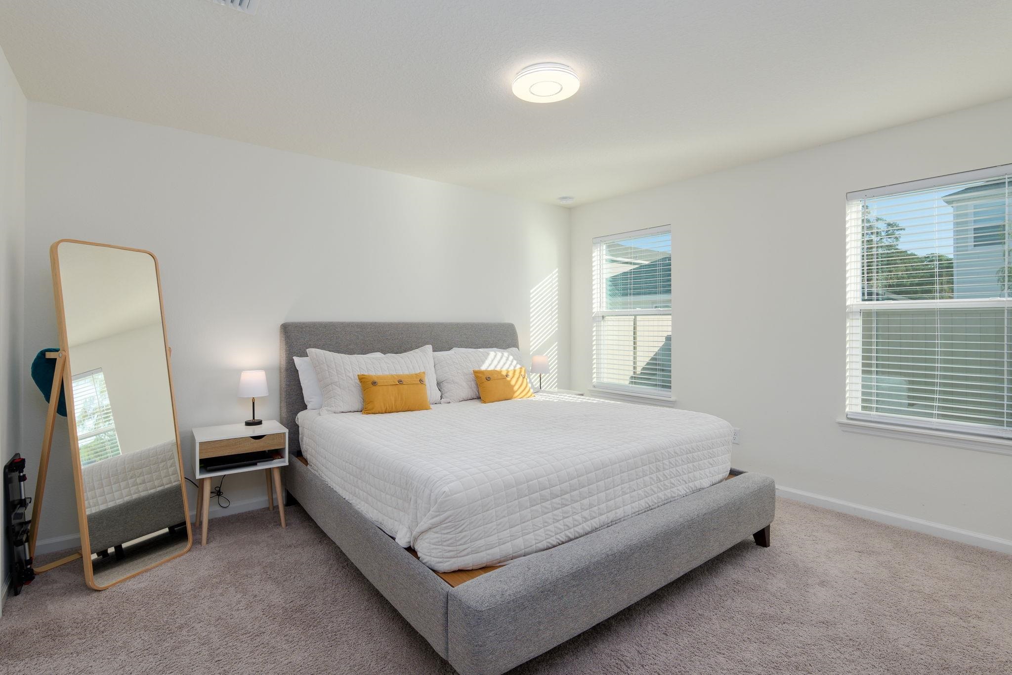 28 Peace River Road St. Johns, FL 32259 - Photo 16 of 42 a bedroom with a bed and a window