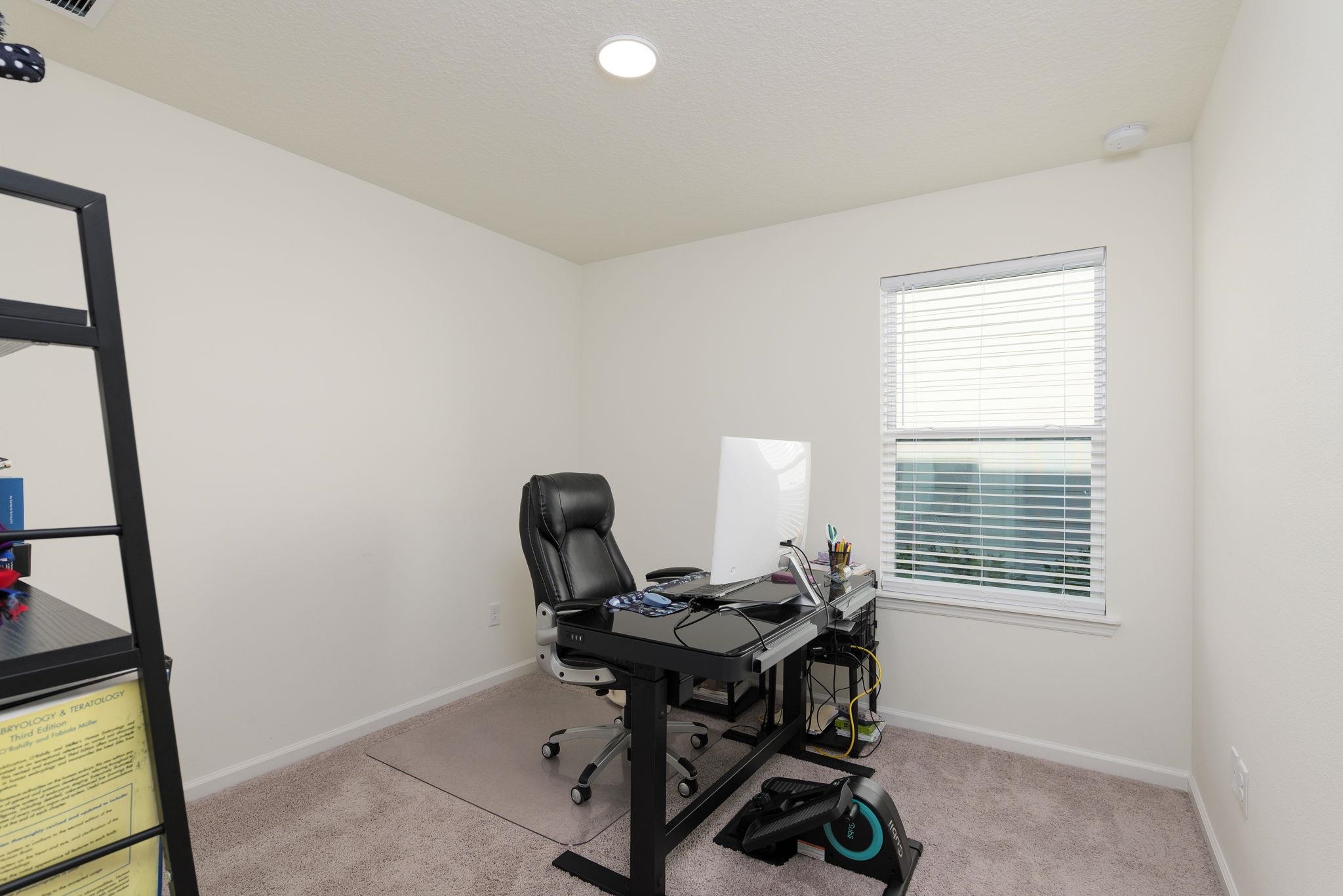 28 Peace River Road St. Johns, FL 32259 - Photo 21 of 41 a view of a workspace with furniture and a window