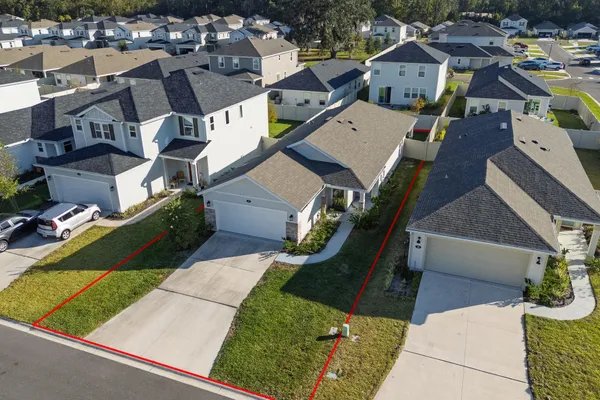 an aerial view of a house with a garden