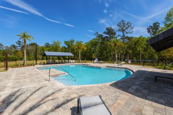 a view of a swimming pool with a patio