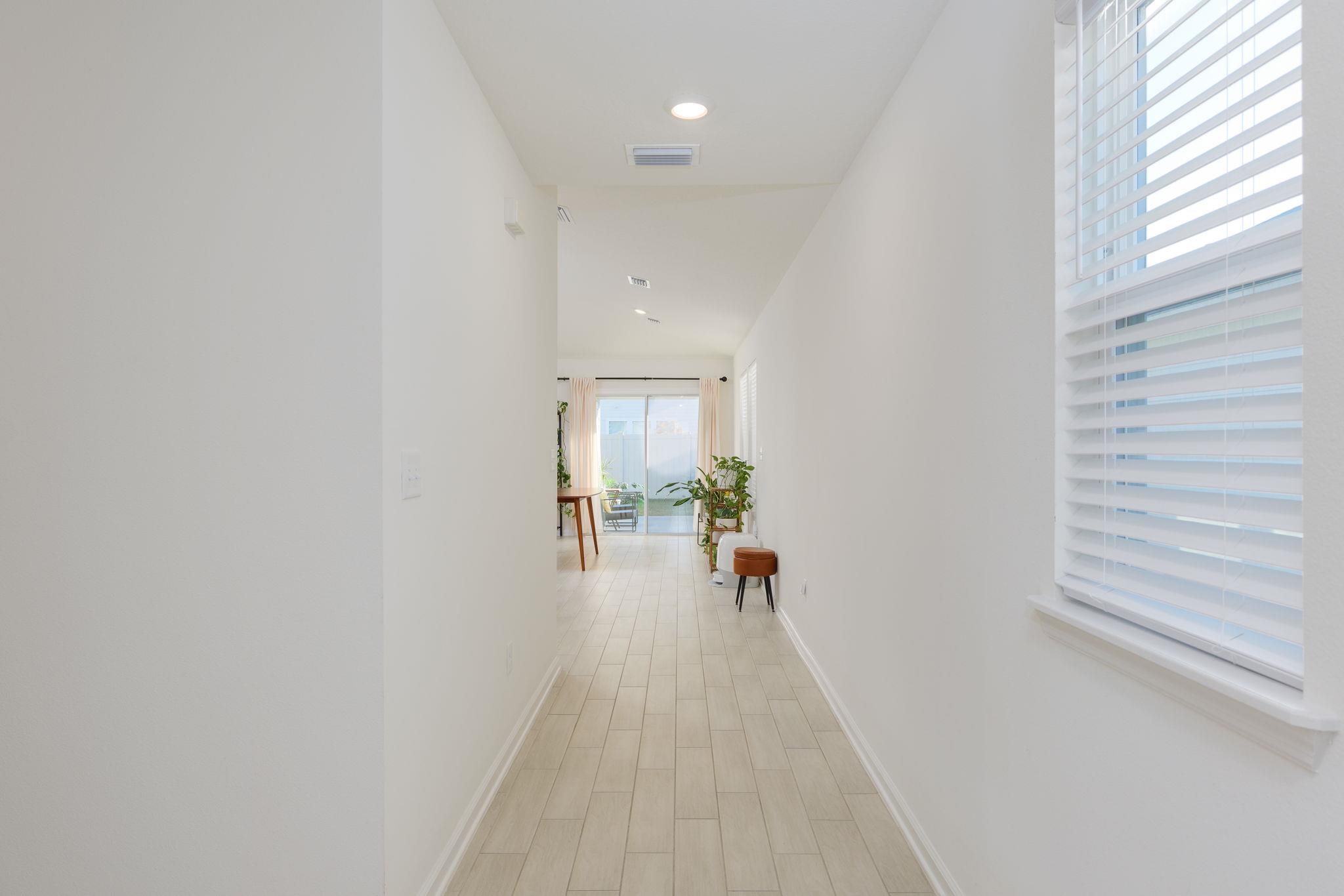 28 Peace River Road St. Johns, FL 32259 - Photo 9 of 41 a view of a hallway with a white walls and a window