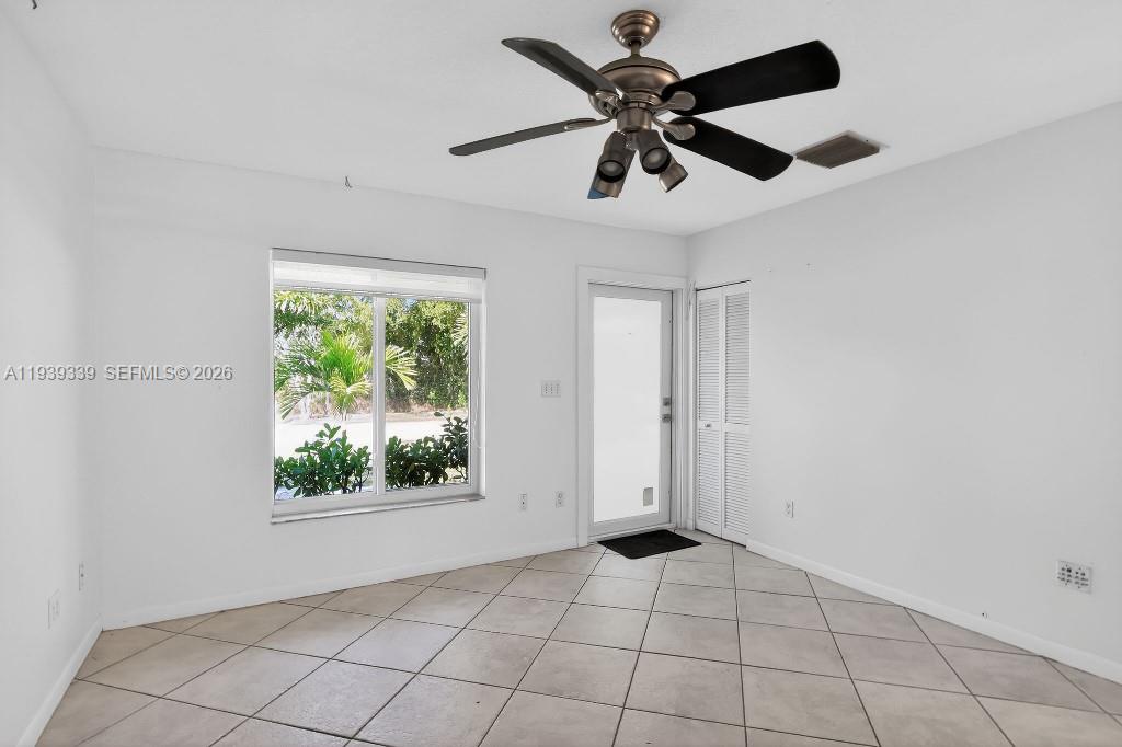 9900 Southwest 164th Terrace Miami, FL 33157 - Photo 12 of 44 a view of an empty room with a window