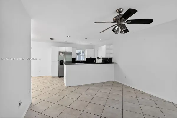 a view of a kitchen with a sink and cabinets
