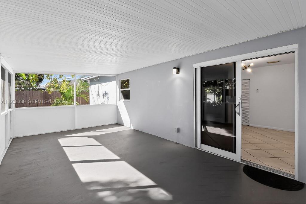 9900 Southwest 164th Terrace Miami, FL 33157 - Photo 2 of 44 an empty room with windows