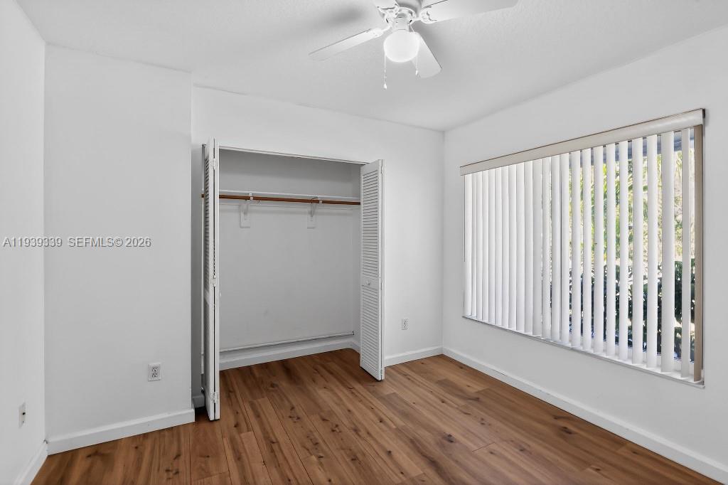 9900 Southwest 164th Terrace Miami, FL 33157 - Photo 21 of 44 wooden floor in an empty room with a window