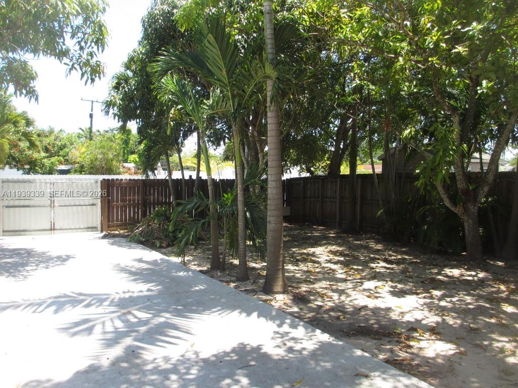 9900 Southwest 164th Terrace Miami, FL 33157 - Photo 32 of 44 a view of a tree in the middle of a yard