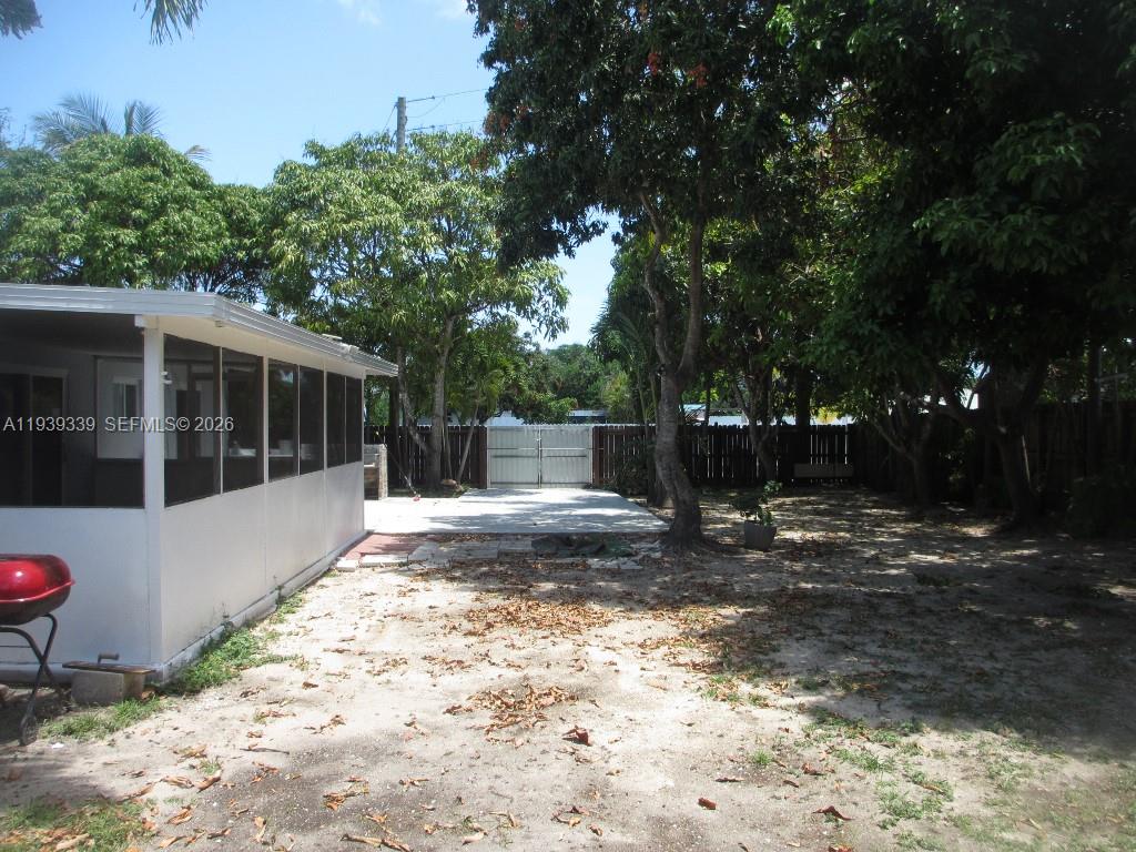 9900 Southwest 164th Terrace Miami, FL 33157 - Photo 40 of 44 a view of a house with backyard and sitting area