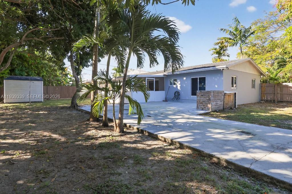 9900 Southwest 164th Terrace Miami, FL 33157 - Photo 4 of 44 a view of a house with a yard and tree