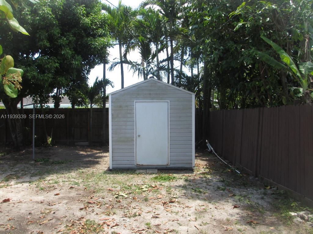 9900 Southwest 164th Terrace Miami, FL 33157 - Photo 42 of 44 a backyard of a house