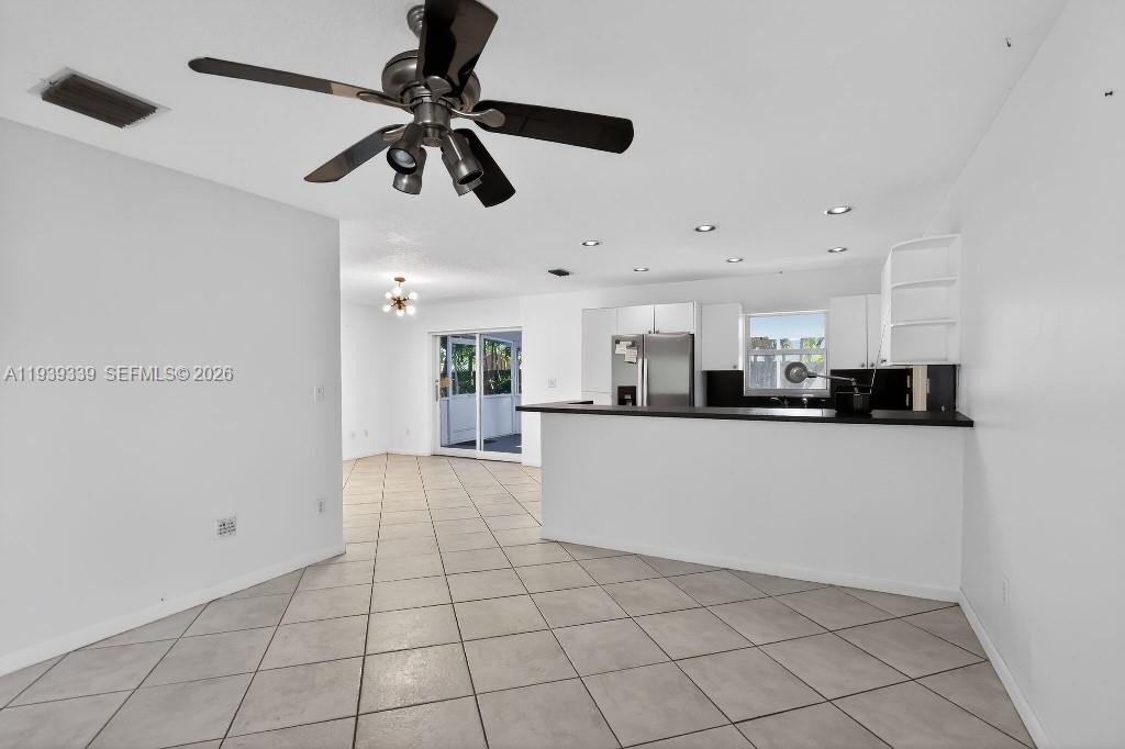 9900 Southwest 164th Terrace Miami, FL 33157 - Photo 8 of 44 a view of kitchen with stainless steel appliances a refrigerator and cabinets