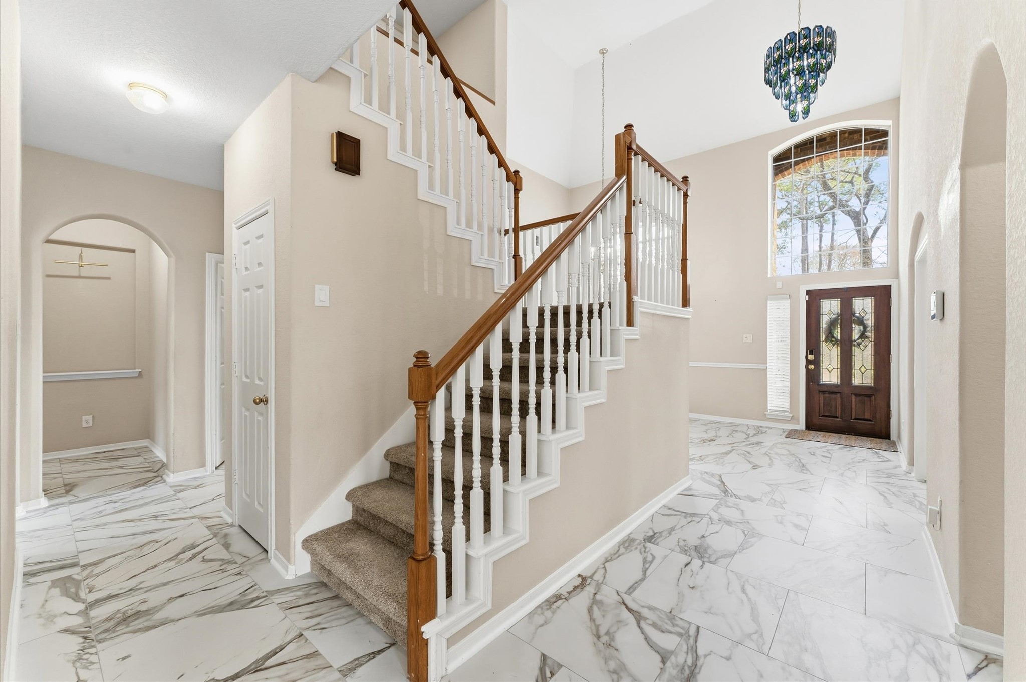 91 South Downy Willow Circle Spring, TX 77382 - Photo 12 of 50 a view of a hallway with wooden floor and staircase
