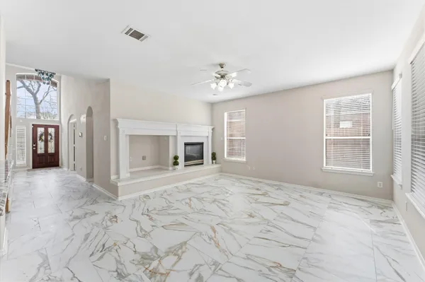 a view of an empty room with a window