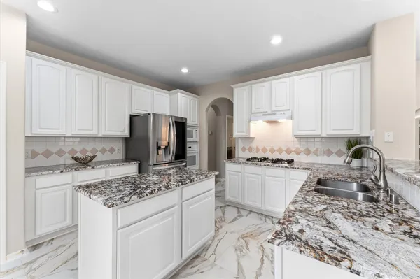 a view of a living room and a balcony