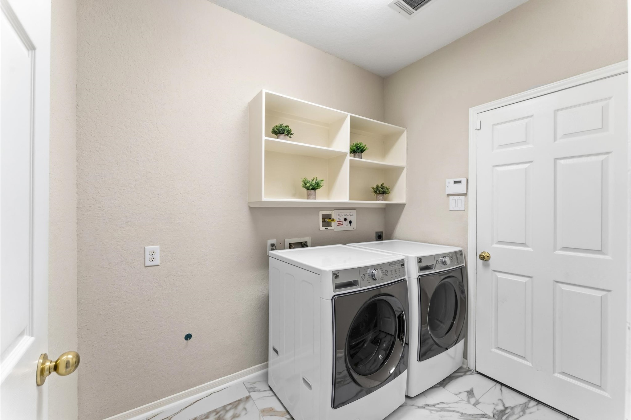 91 South Downy Willow Circle Spring, TX 77382 - Photo 21 of 50 Utility Room complete with Washer & Dryer and room for a fridge, freezer, folding table...