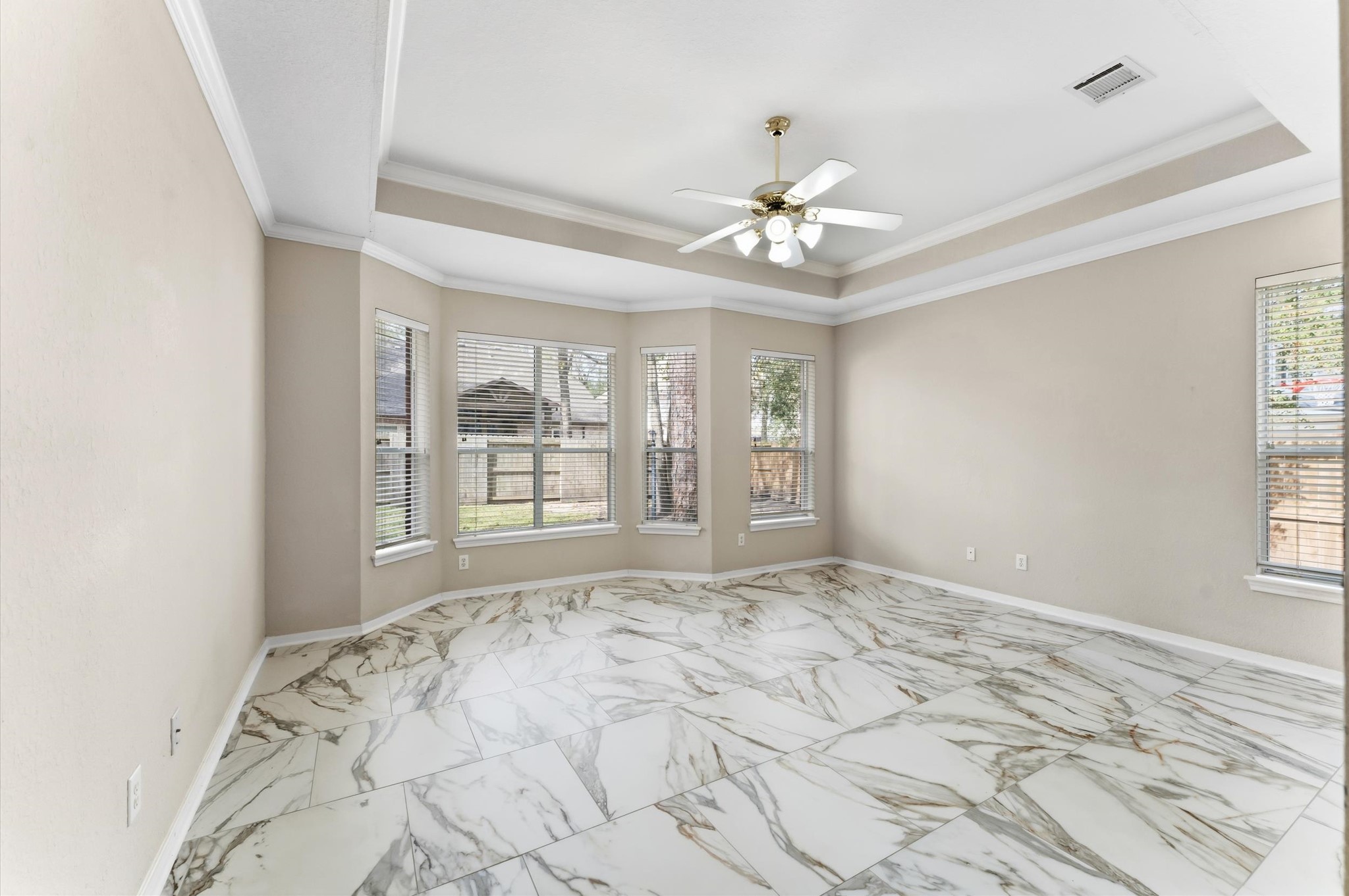 91 South Downy Willow Circle Spring, TX 77382 - Photo 22 of 50 a view of a bedroom with a large bed and a window