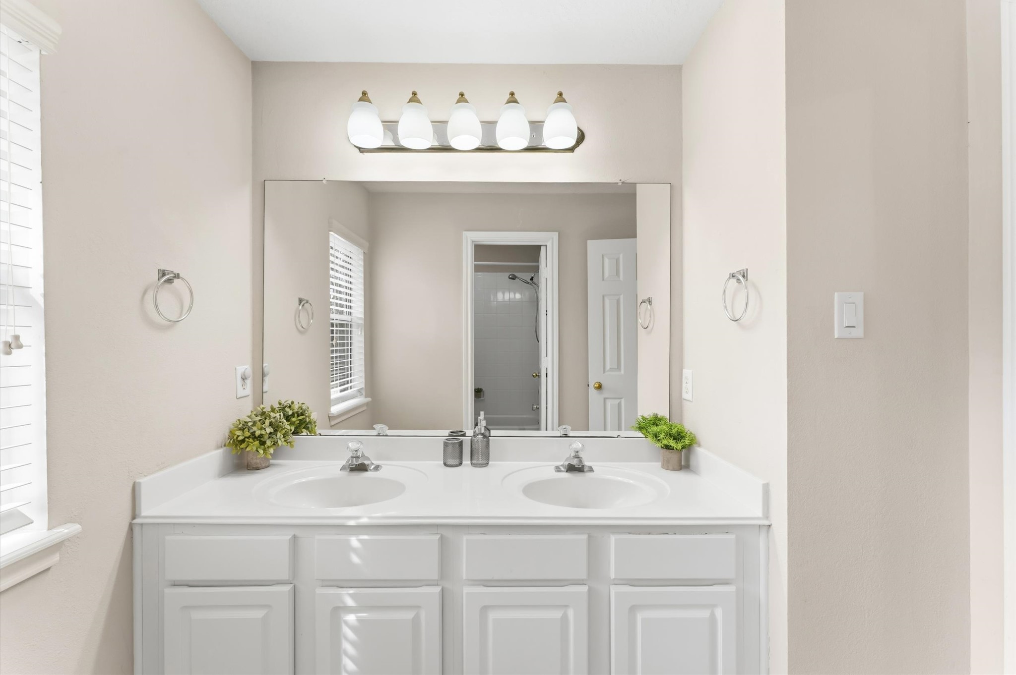91 South Downy Willow Circle Spring, TX 77382 - Photo 30 of 50 a bathroom with a sink vanity and a mirror