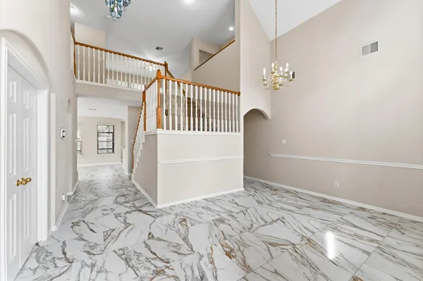 a bathroom with a granite countertop sink a toilet and mirror