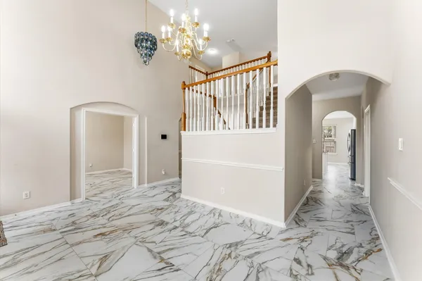 a view of a bedroom with a large bed and a window