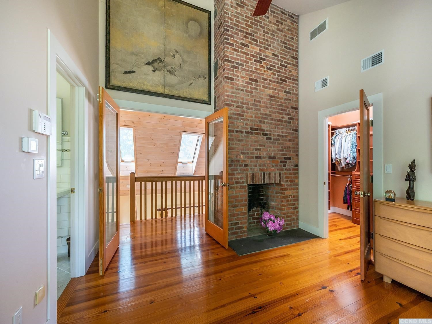 730 Oak Hill Road Claverack, NY 12534 - Photo 13 of 33 a view of a hallway with wooden floor and a dining room