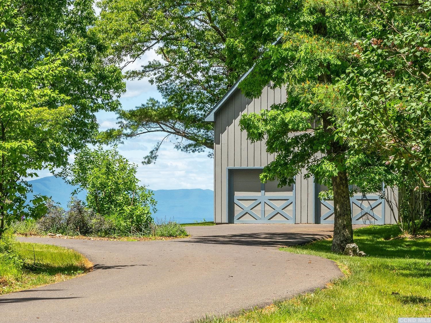 730 Oak Hill Road Claverack, NY 12534 - Photo 24 of 33 a front view of a house with a yard and garage