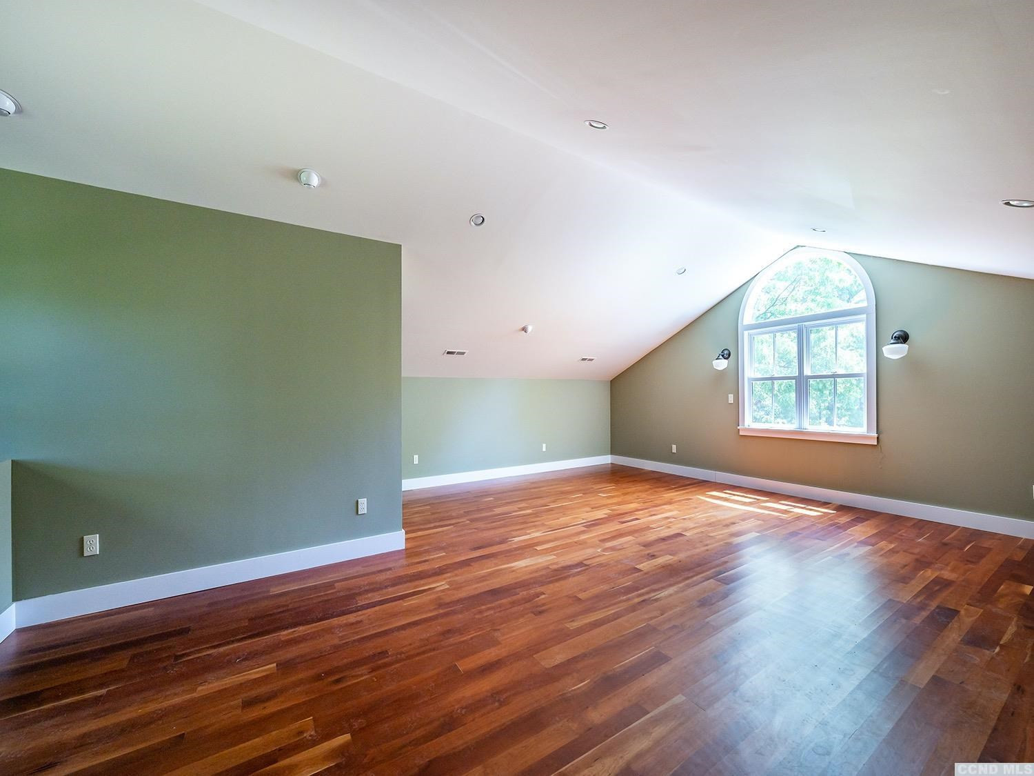 730 Oak Hill Road Claverack, NY 12534 - Photo 25 of 33 an empty room with wooden floor and windows