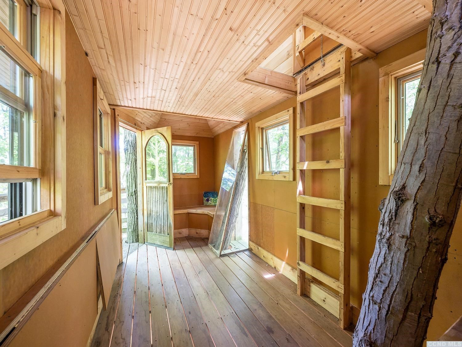 730 Oak Hill Road Claverack, NY 12534 - Photo 28 of 33 a view of a balcony with wooden floor and furniture