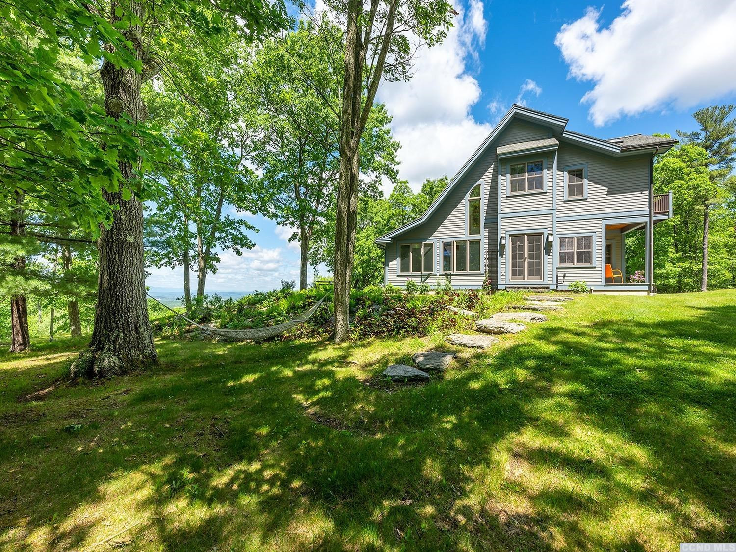 730 Oak Hill Road Claverack, NY 12534 - Photo 32 of 33 a front view of a house with a garden