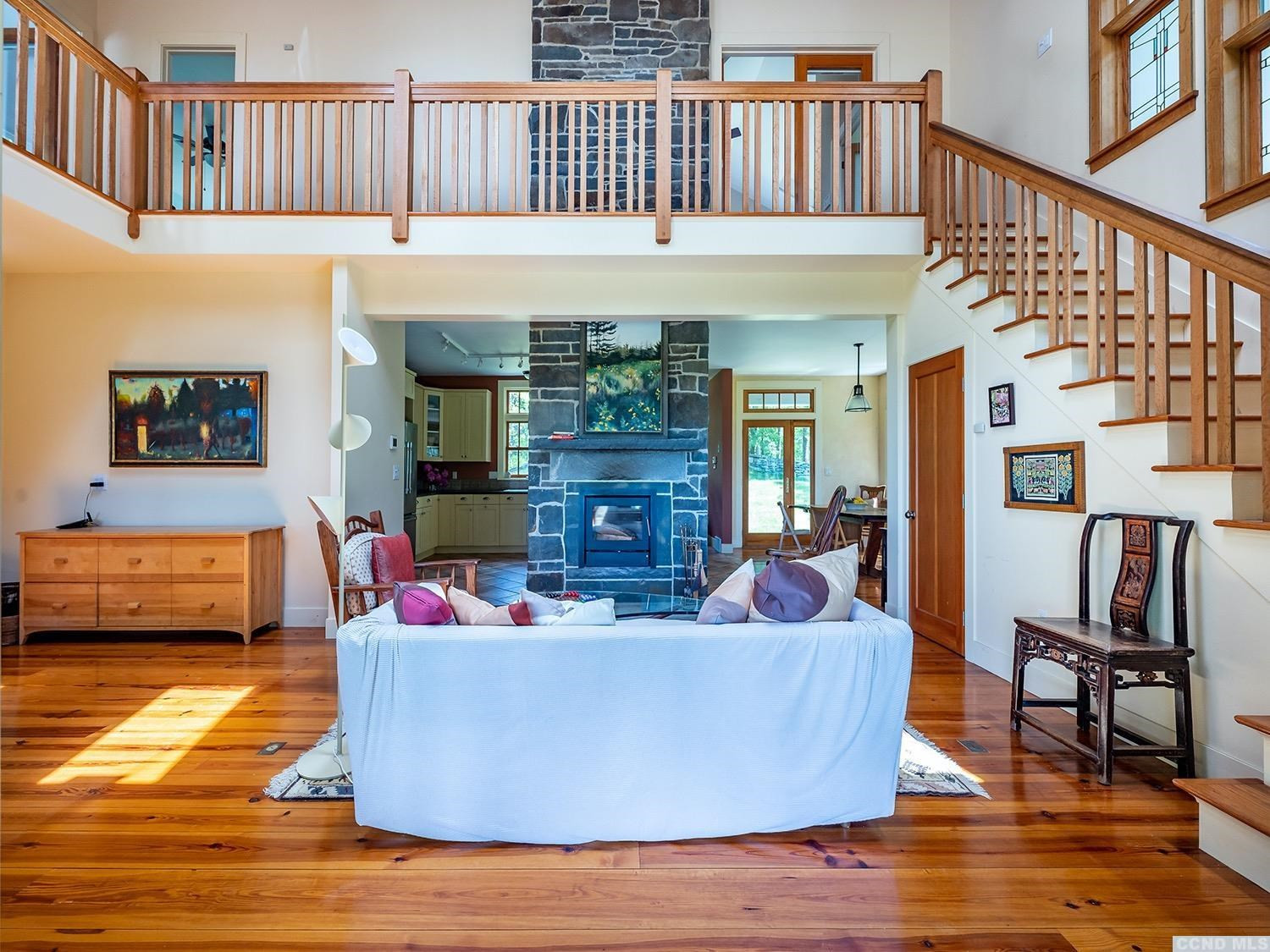 730 Oak Hill Road Claverack, NY 12534 - Photo 6 of 33 a living room with fireplace furniture and a wooden floor