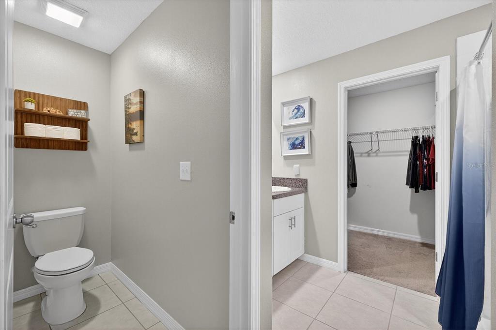 6115 Apple Snail Avenue New Port Richey, FL 34653 - Photo 17 of 59 a bathroom with a toilet and a shower