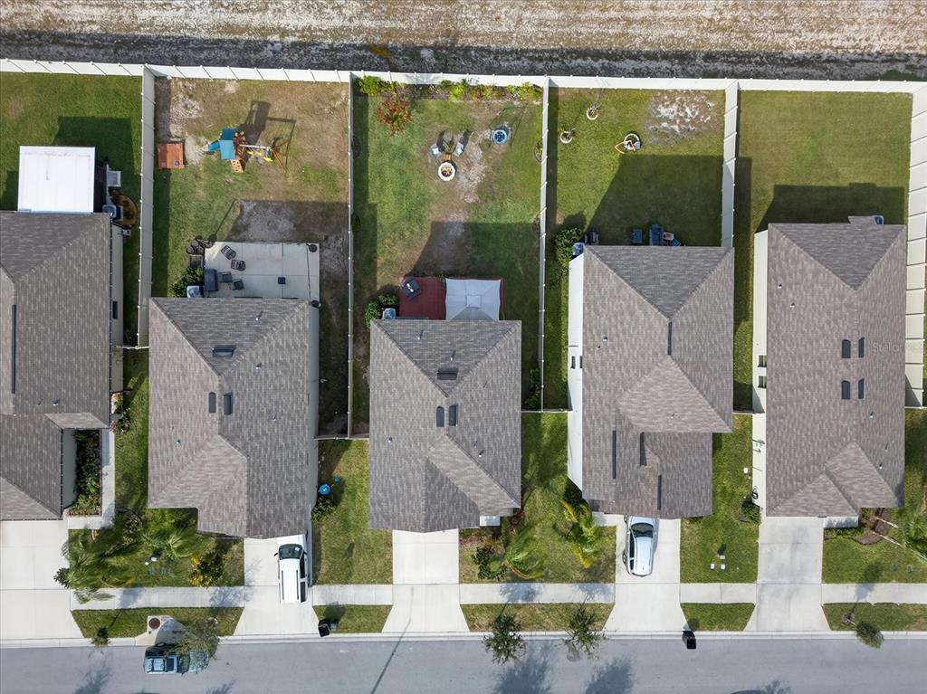 6115 Apple Snail Avenue New Port Richey, FL 34653 - Photo 28 of 59 aerial view of a house with garden
