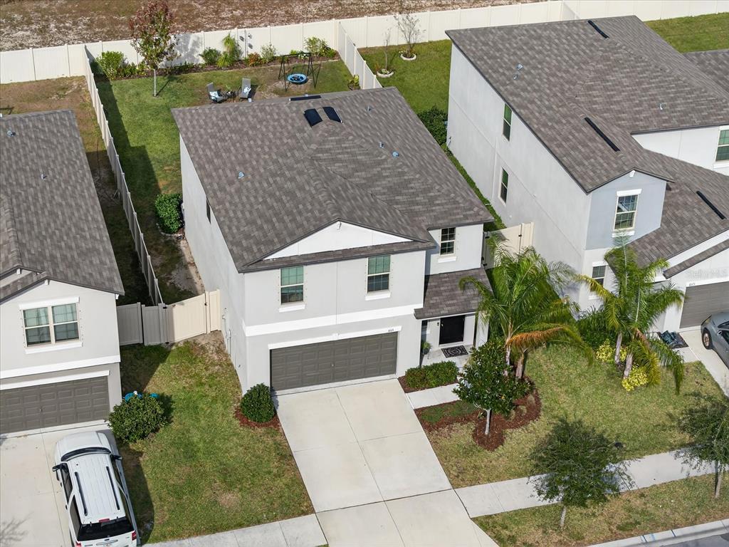 6115 Apple Snail Avenue New Port Richey, FL 34653 - Photo 51 of 59 a aerial view of a house with a yard