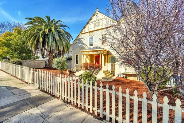 a view of a house with a small yard