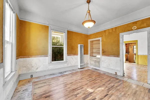 a view of a livingroom with wooden floor