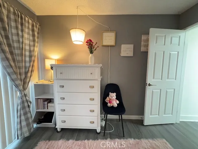 a bedroom with a bed and cabinets
