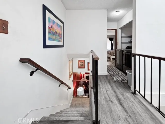 a view of a hallway with seating area