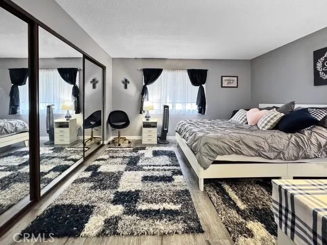 a bed sitting in a bedroom next to a window