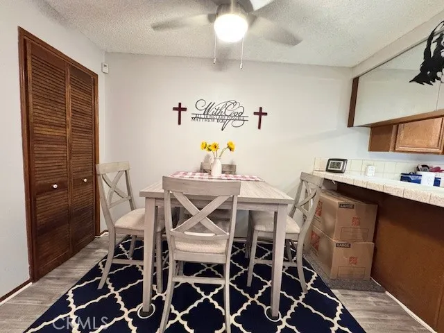 a view of a dining room with furniture and a chandelier