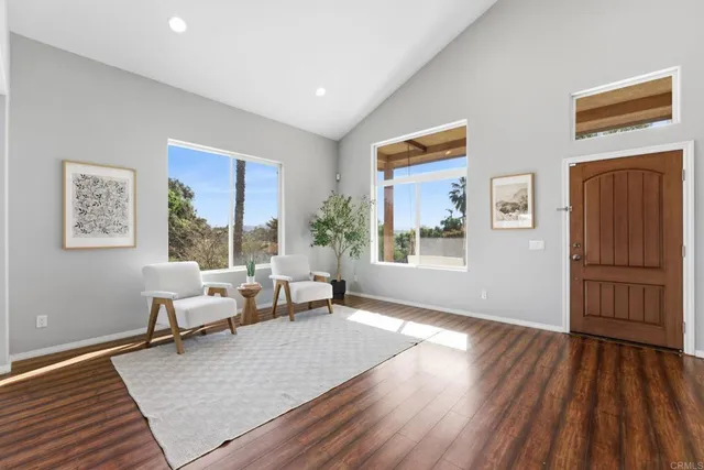 a view of livingroom with furniture and front door
