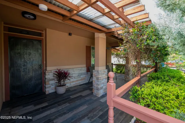 a potted plant sitting in front of a glass door