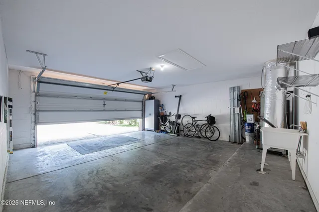 a view of a garage with parked cars