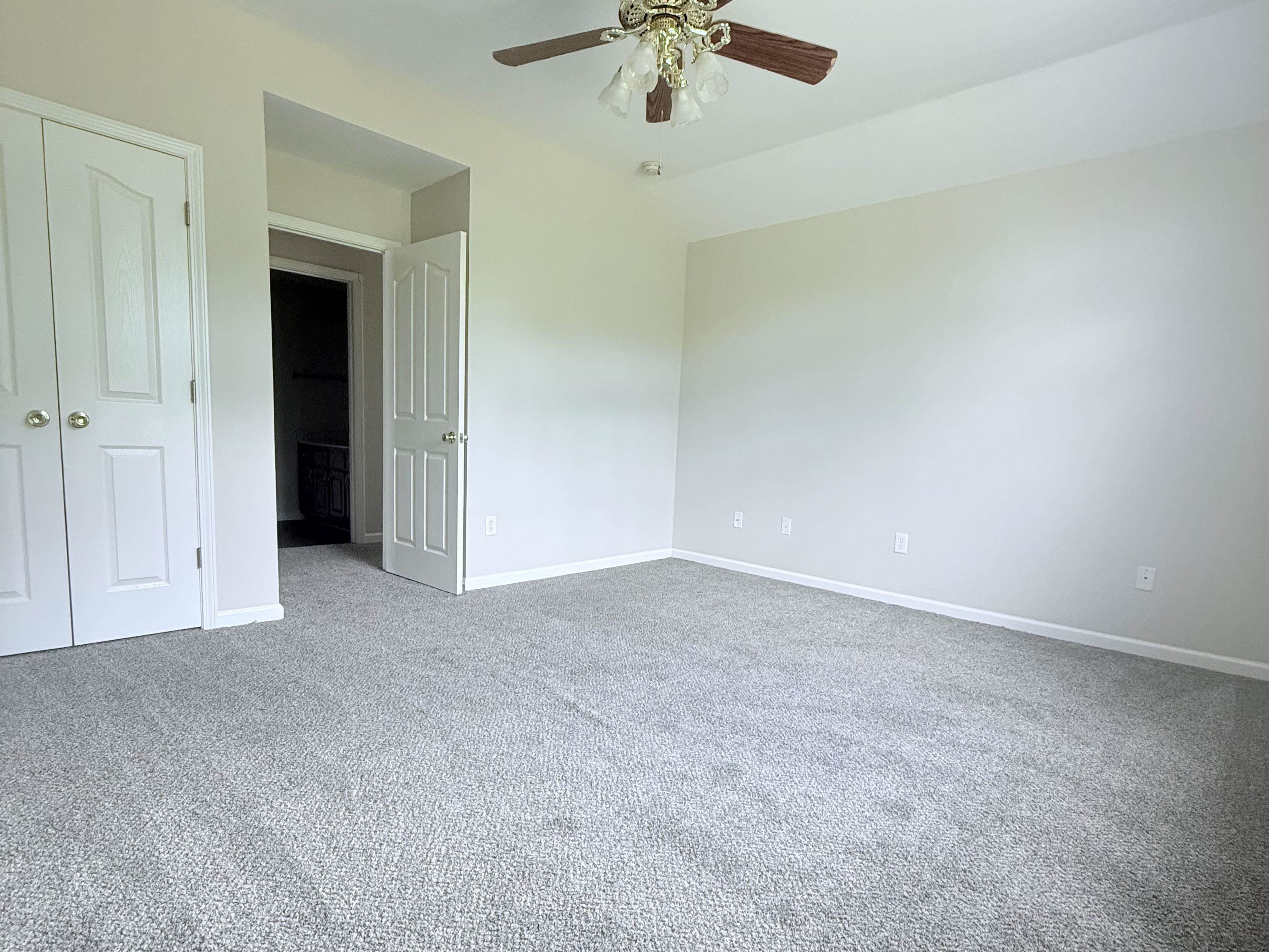 856 Reed Circle Drummonds, TN 38023 - Photo 16 of 24 a view of an empty room and chandelier fan