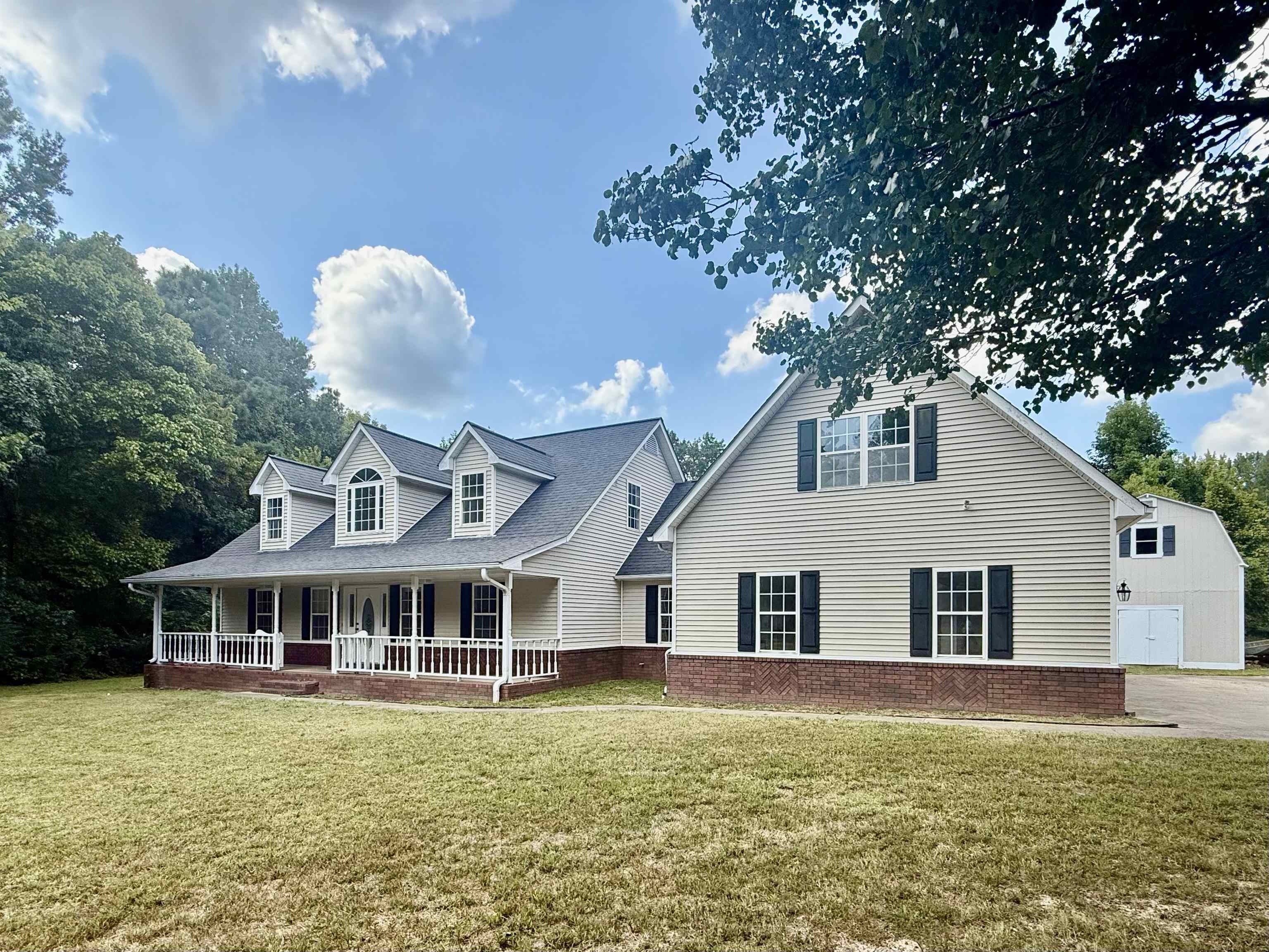856 Reed Circle Drummonds, TN 38023 - Photo 2 of 24 a front view of a house with a garden
