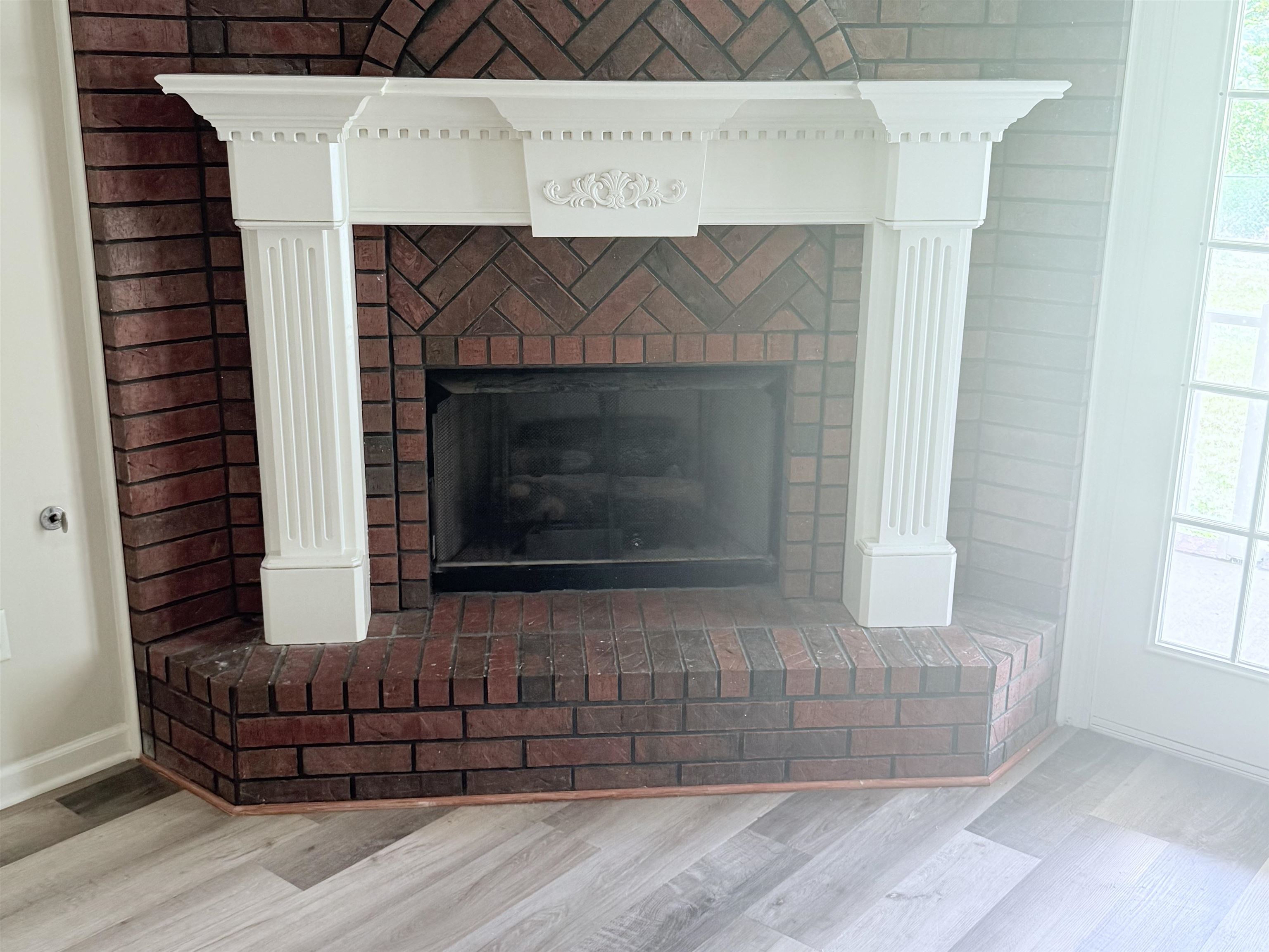 856 Reed Circle Drummonds, TN 38023 - Photo 9 of 24 a fireplace with a wooden floor