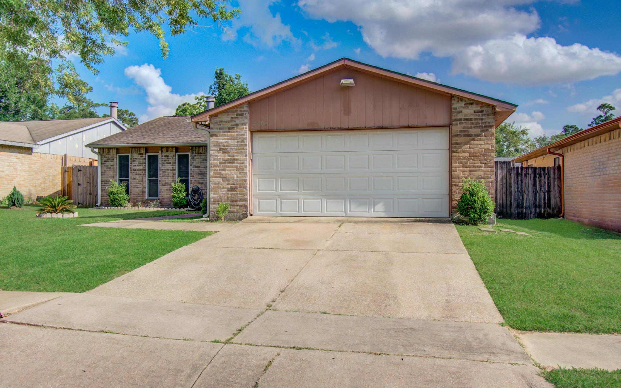 5706 Spring Grove Lane Spring, TX 77373 - Photo 2 of 12 a front view of a house with a yard