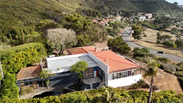 an aerial view of a house with garden