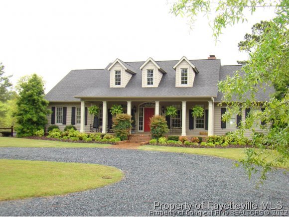 4435 Hoffman Road Jackson Springs, NC 27281 - Photo 1 of 25 a front view of a house with garden