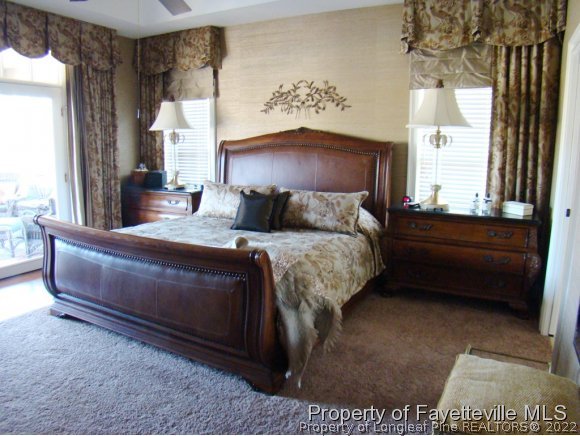 4435 Hoffman Road Jackson Springs, NC 27281 - Photo 13 of 25 a bedroom with a bed dresser and a window
