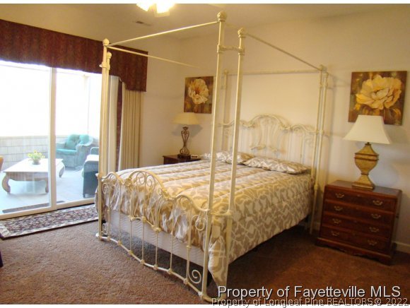 4435 Hoffman Road Jackson Springs, NC 27281 - Photo 16 of 25 a bed sitting in a bedroom next to a window