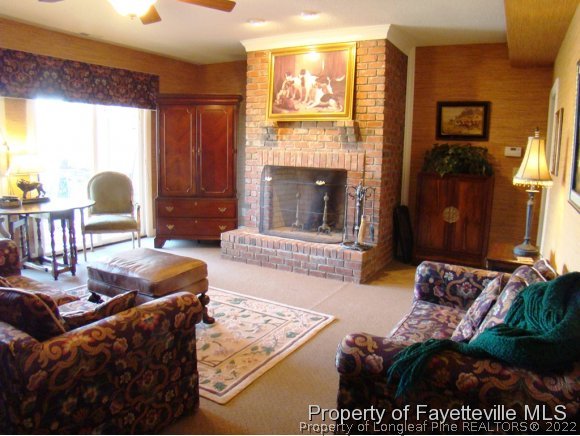 4435 Hoffman Road Jackson Springs, NC 27281 - Photo 18 of 25 a living room with furniture and a fireplace